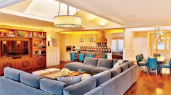 This design illustrates a perfect balance of daylight and electric light. Light layers are well articulated; CCT, luminaire location, and light levels all work in harmony; skylights and windows are considered almost as additional luminaires; and glare is completely absent. This can be seen as an example of excellent design and integrative lighting, where beauty, health, comfort, and efficiency are all achieved without tradeoffs. Lighting Design: Randall Whitehead, Interior Design: Kristi Will Home + Design. (Photo credit: Image by Dennis Anderson, courtesy of Randall Whitehead.)