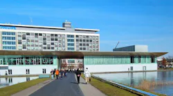 Signify's headquarters are located at Eindhoven's High Tech Campus, a site established in 1998 by former Signify owner Philips, which still houses its innovation group there, and which is home to other technology and research groups as well. Signify will soon provide details on its cutbacks there. (Photo credit: File photo courtesy of Microtoerisme via Wikimedia Commons; used under CC BY-SA 3.0 - http://bit.ly/3piOJep.)
