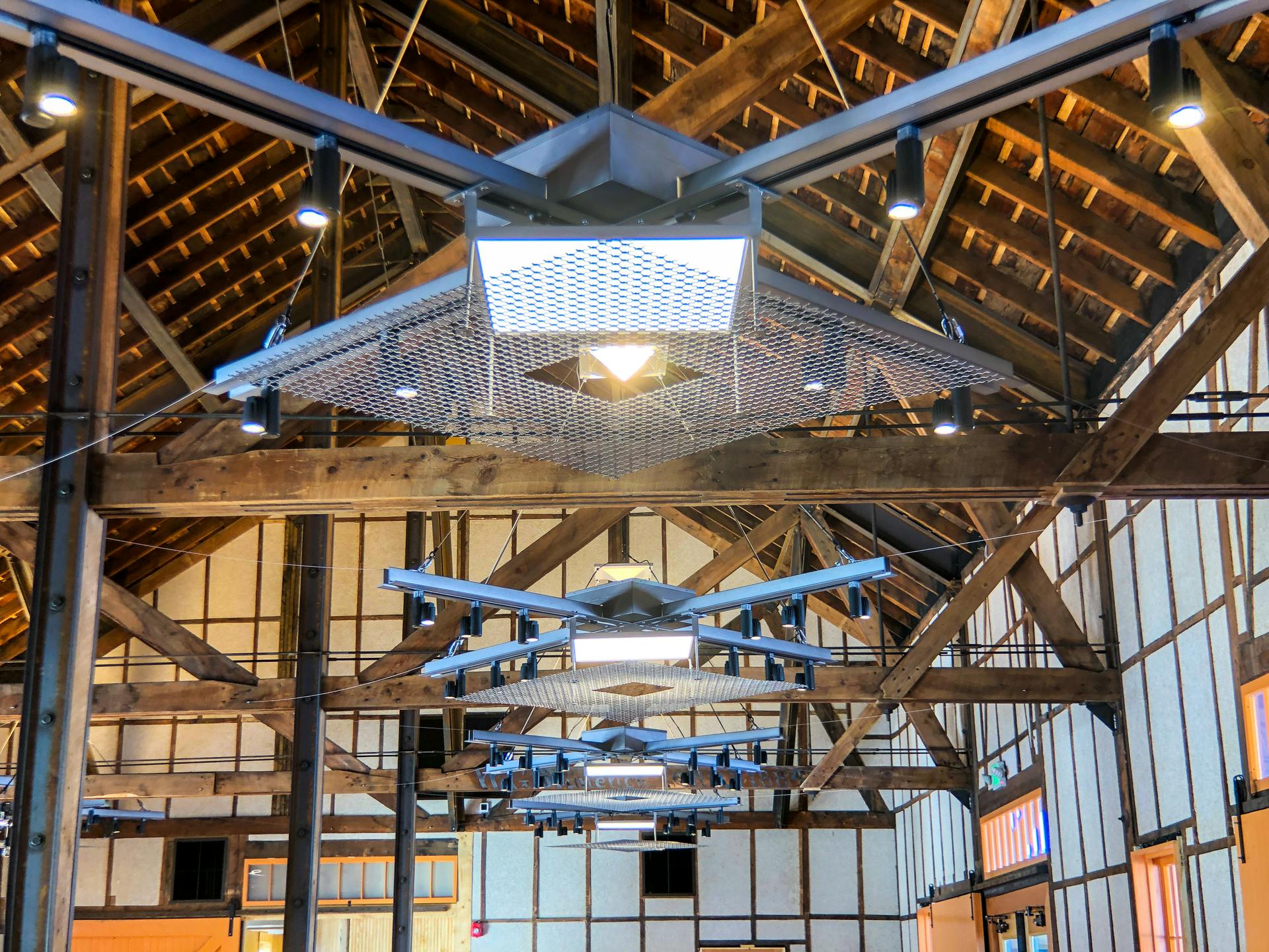 The custom usage of Albeo high-bay LED luminaires from GE Current aligns well with the historic former-freight-depot architecture in a modern update to the Freight events venue in Colorado&rsquo;s Rocky Mountains. (Photo credit: Image courtesy of GE Current, a Daintree company.)