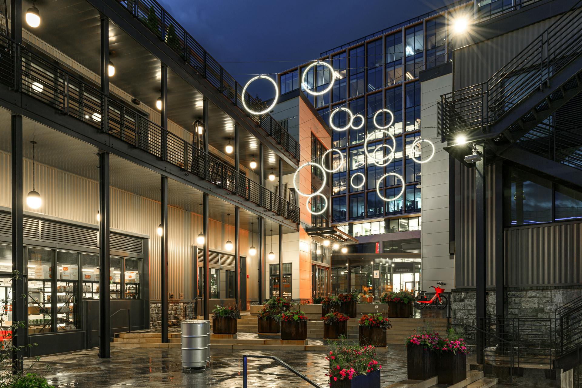 At The Wharf in Washington, DC, iLight&rsquo;s Plexineon LED rings create a unique yet useful feature of interest, conceived by Gilmore Lighting Design to bring more foot traffic to the entry plaza. (Photo credit: Image courtesy of iLight.)