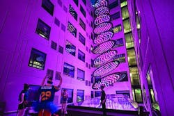 In the millennial-targeted Moxy hotel in San Diego’s Gaslamp Quarter, guestrooms surround a courtyard-like space where an LED-based architainment feature rises from the hotel lobby below through a glass ceiling, delivering dynamic shows conceived to evoke images such as a stream or waterfall. The dynamic RGB-LED-based system was created by Moment Factory and crafted by Digital Ambiance to be a “hero centerpiece fixture” to be enjoyed by guests. (Photo credit: J Street Hospitality.) In the millennial-targeted Moxy hotel in San Diego’s Gaslamp Quarter, guestrooms surround a courtyard-like space where an LED-based architainment feature rises from the hotel lobby below through a glass ceiling, delivering dynamic shows conceived to evoke images such as a stream or waterfall. The dynamic RGB-LED-based system was created by Moment Factory and crafted by Digital Ambiance to be a “hero centerpiece fixture” to be enjoyed by guests. (Photo credit: J Street Hospitality.)