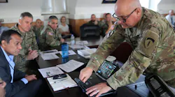 US Army Chief Warrant Officer Andrew Foreman demonstrates Getac hardware working with the Kitefin Li-Fi system at Wiesbaden Army Garrison last August. (Photo credit: Image courtesy of Candy Knight via pureLiFi.)