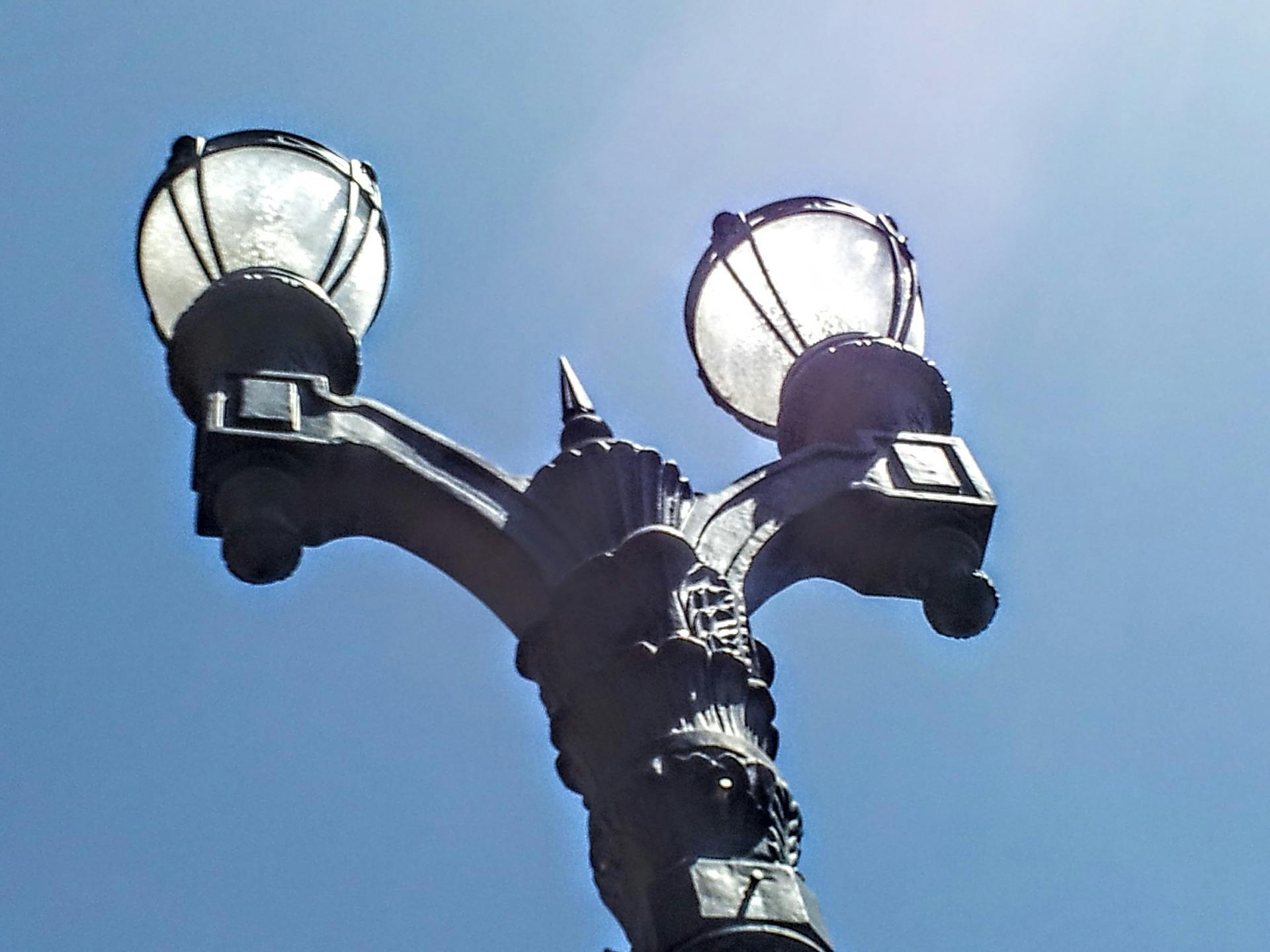 This is one of about 400 different lamppost designs in use in Los Angeles. All could potentially check whether you're at 98.6 degrees. They can also detect when crowds are defying social distancing conventions. (Photo credit: Image by Pexels via Pixabay; used under free license for commercial or non-commercial purposes.)
