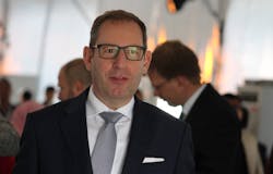 It won’t be four more years for Stefan Kampmann, who joined Osram as chief technology officer in 2016, but who is out under the new ams supervisory regime. He’s pictured here at Osram’s 2017 Kulim, Malaysia factory opening. (Photo credit: Image courtesy of Mark Halper.) It won’t be four more years for Stefan Kampmann, who joined Osram as chief technology officer in 2016, but who is out under the new ams supervisory regime. He’s pictured here at Osram’s 2017 Kulim, Malaysia factory opening. (Photo credit: Image courtesy of Mark Halper.)