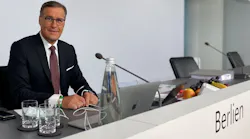 Outgoing Osram CEO Olaf Berlien sits at the top table here at the company's shareholders' meeting earlier this month, where voters approved the ams 'domination' status that is now leading to his ouster. At the time, Berlien said that the domination 'will enable Osram and ams together to forge the European global market leader in optical solutions.' (Photo credit: Image courtesy of Osram.)
