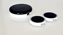 The larger of the three Oledcomm disks is the transmitter, designed to mount on a ceiling and attach to Ethernet cable. The smaller two are dongles, which attach to a laptop via USB cable, to deliver Li-Fi. (Photo credit: Image courtesy of Oledcomm.)