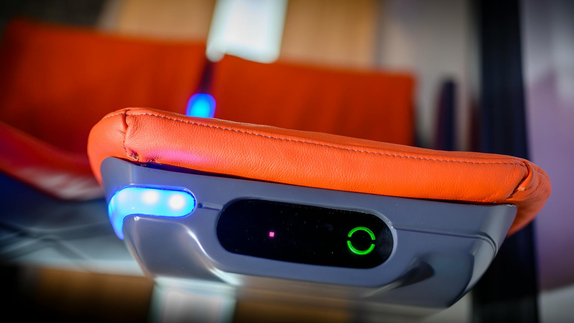 This transceiver in the center of a headrest receives the infrared Li-Fi signal and wires it to a video screen mounted just below it on the seatback. (Photo credit: Image courtesy of Signify.)