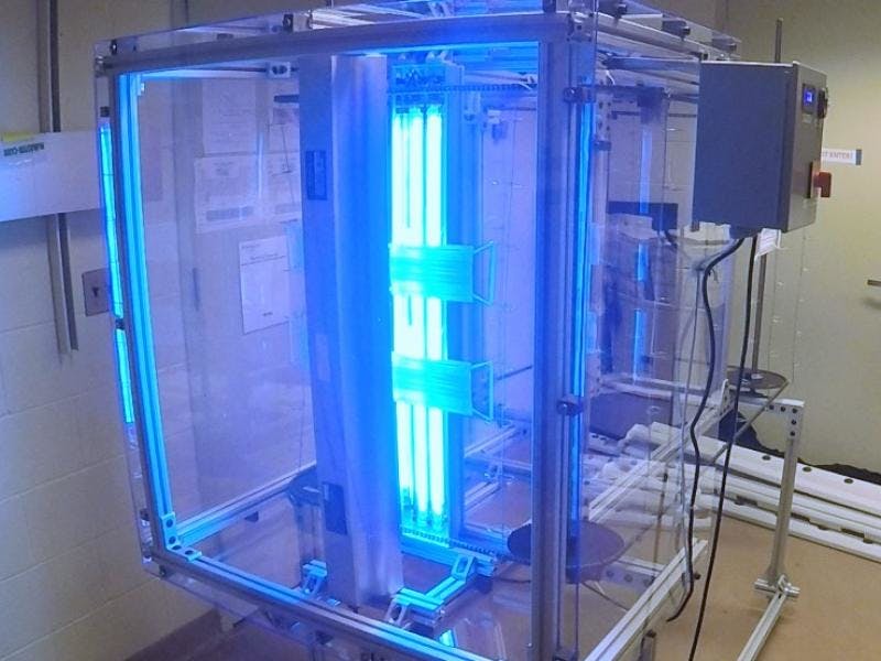 An interdisciplinary team of engineers and scientists from Rensselaer Polytechnic Institute (RPI) and the Lighting Enabled Systems & Applications (LESA) center has designed and test a disinfection chamber, utilizing ultraviolet radiation, for sterilizing masks used as personal protective equipment. (Photo credit: image courtesy of LESA/RPI.)