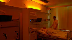 A stroke patient under soft warm nighttime lighting at Righospitalet, with neurologist Anders West of the University of Copenhagen. (Photo credit: Image courtesy of Chromaviso.)