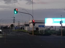 FIG. 1. In Hamilton, New Zealand, a digital billboard located close to an intersection with display colors similar to traffic signals could interfere with drivers’ attention and reaction time. FIG. 1. In Hamilton, New Zealand, a digital billboard located close to an intersection with display colors similar to traffic signals could interfere with drivers’ attention and reaction time.