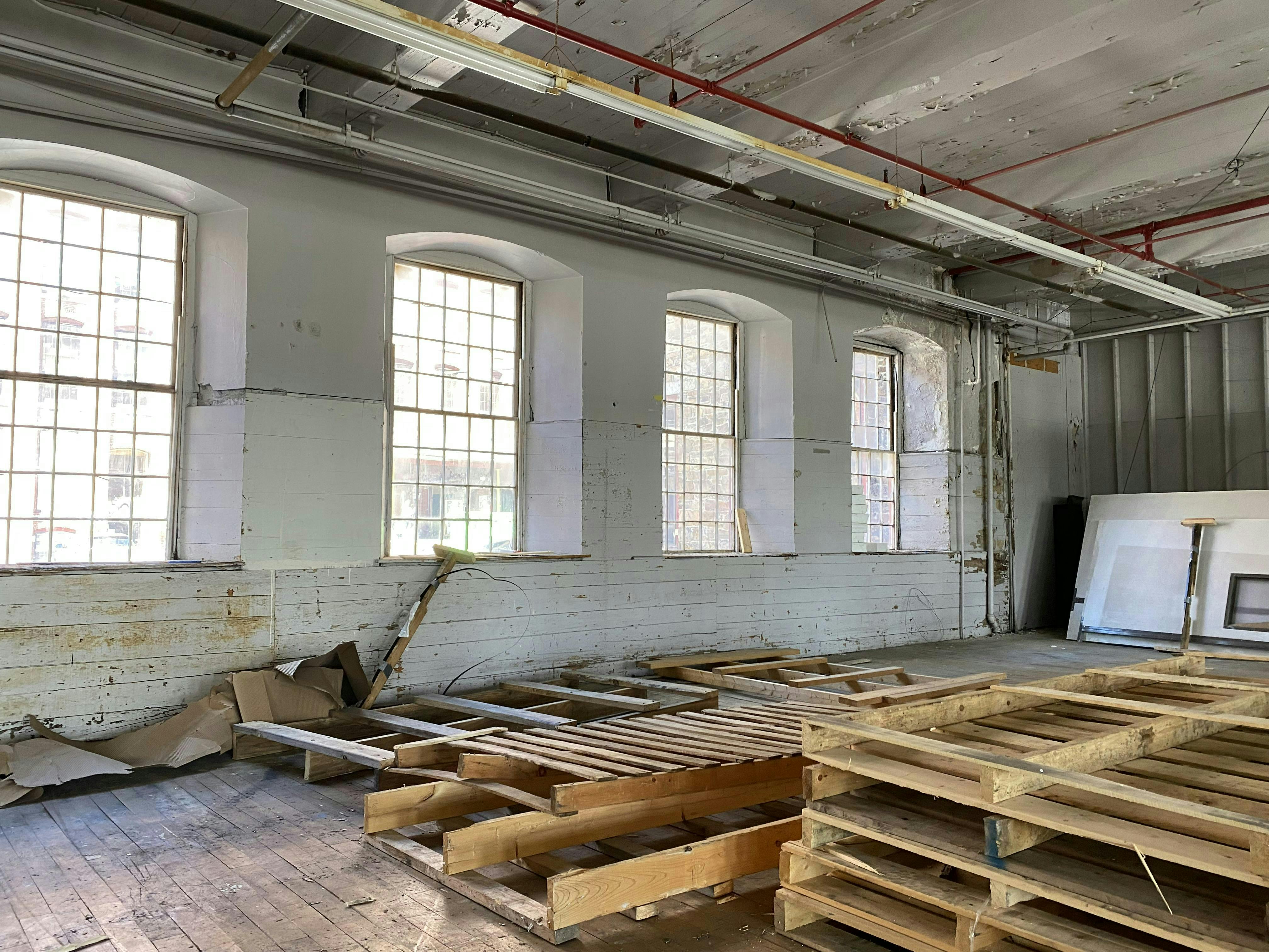 Before shot of a run-down loft space in the historic Stone Hill building.