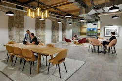 Common area with conference table and guest seating. Common area with conference table and guest seating.