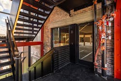 Narrow-profile, fire-rated frames preserve a coherent design in stairwell applications. Narrow-profile, fire-rated frames preserve a coherent design in stairwell applications.