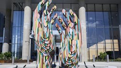 Resembling two hands carved from colored pencils, “Drawn Together” reflects community and connection—core values embedded in the TIAA art experience. Resembling two hands carved from colored pencils, “Drawn Together” reflects community and connection—core values embedded in the TIAA art experience.