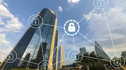 Tall commercial buildings skyline with digital overlay of interconnected pad locks as cybersecurity concept.