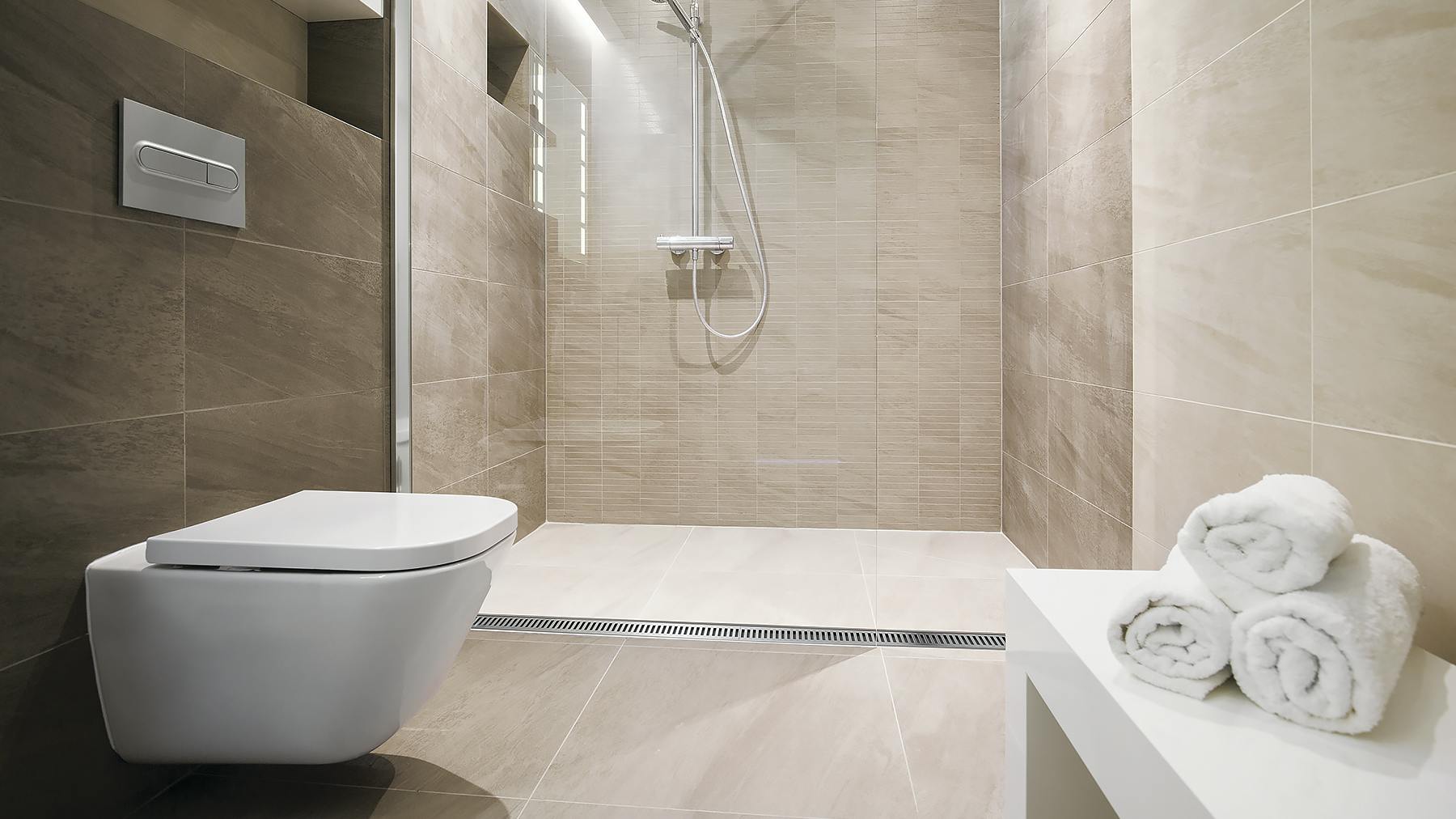 A tub-to-shower conversion kit offers a solution for curbless showers accommodating universal designs in accordance with the Americans with Disabilities Act.