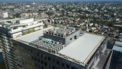 Aerial view of HVAC equipment on rooftop of commercial building. Aerial view of HVAC equipment on rooftop of commercial building.
