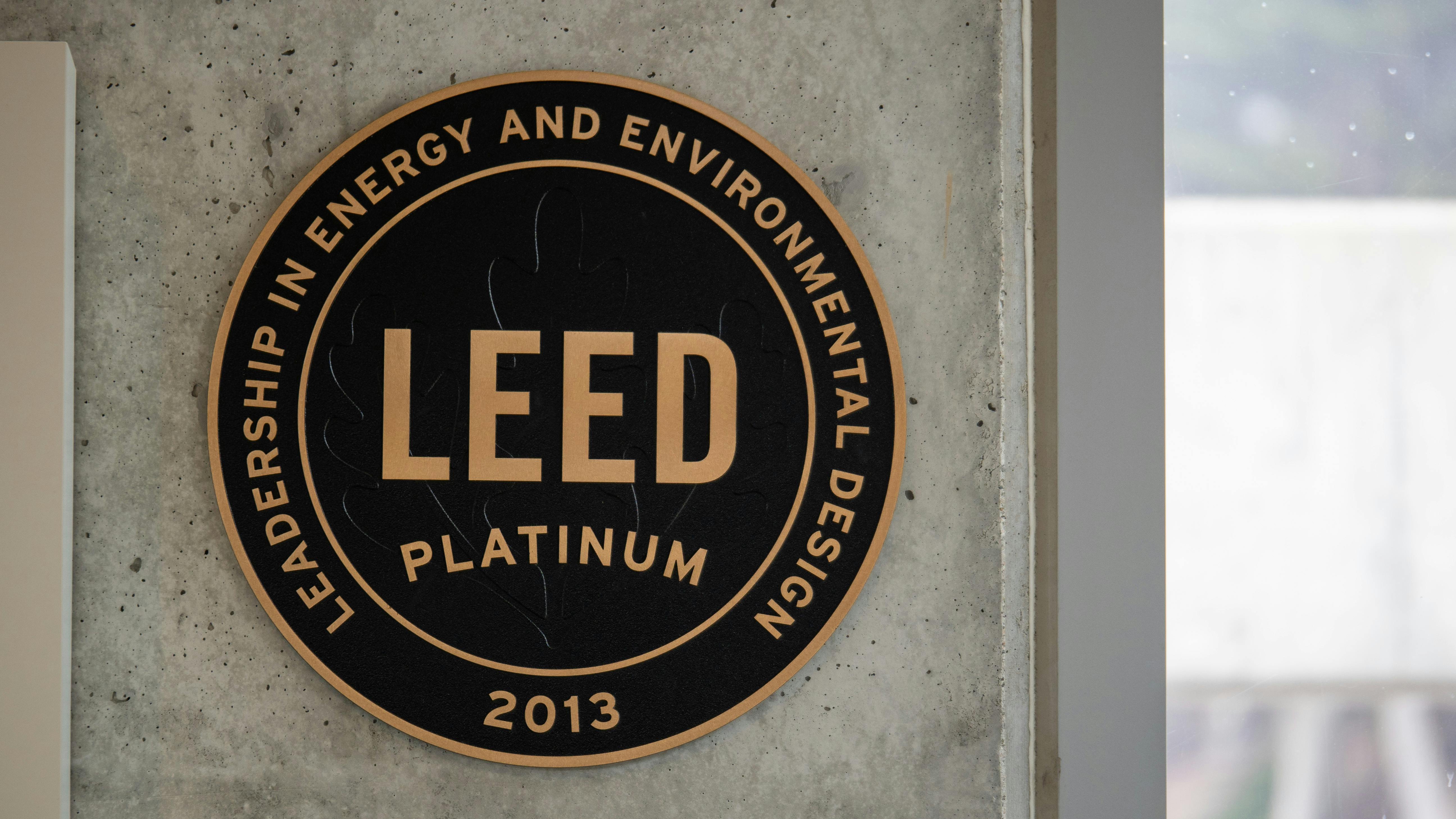 This LEED Platinum plaque appears on a concrete wall at a National Park Service building in San Francisco.