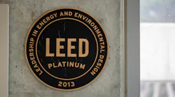 This LEED Platinum plaque appears on a concrete wall at a National Park Service building in San Francisco.