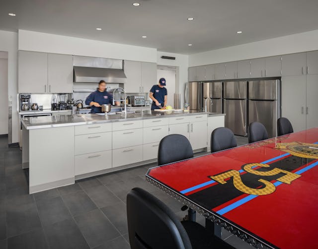 The kitchen area features a gas range by request to support the cooking culture in the fire department. The kitchen area features a gas range by request to support the cooking culture in the fire department.