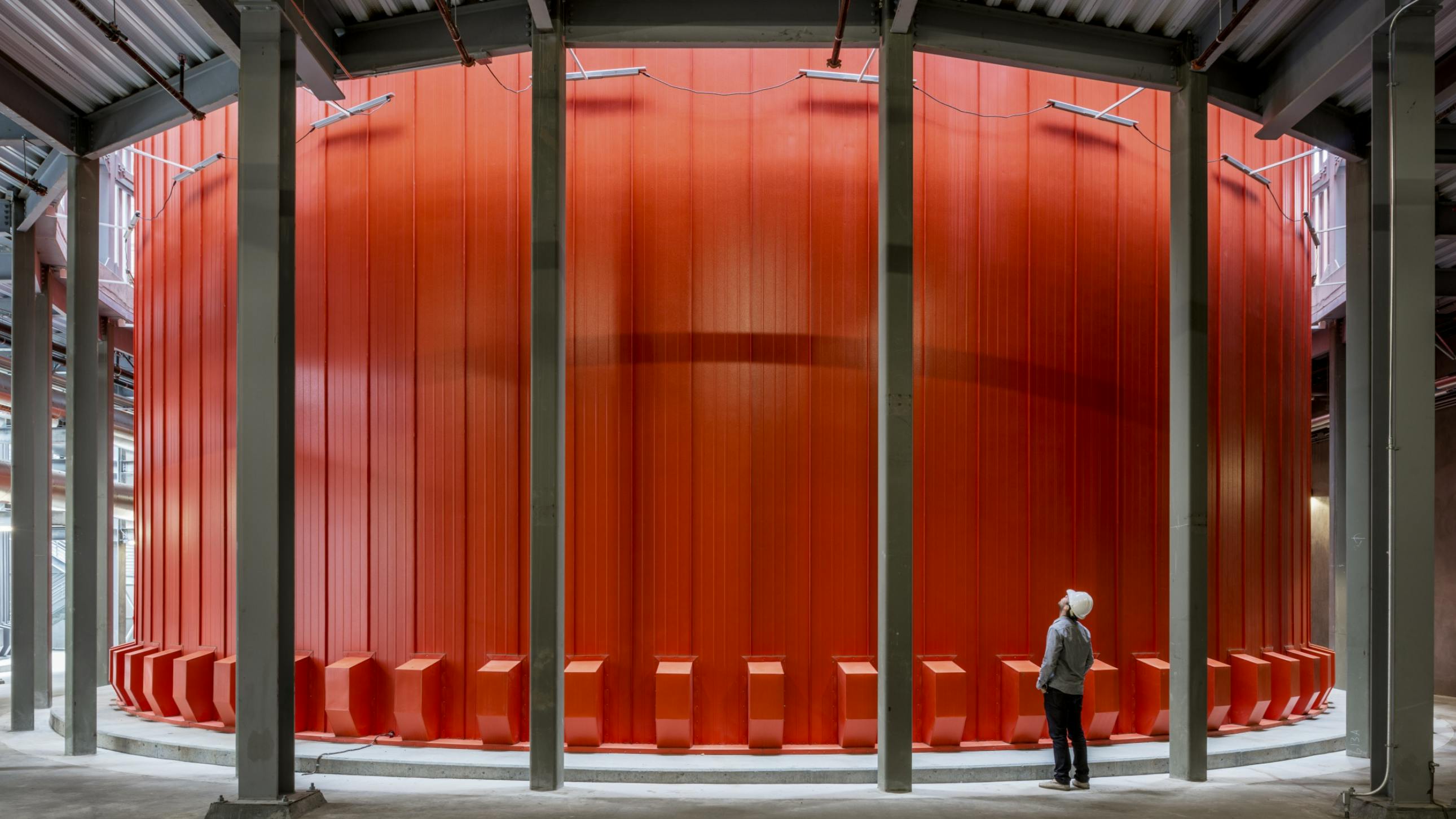District energy systems can incorporate many types of generation and storage technologies. This tank provides hot water thermal energy storage.