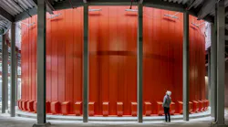 District energy systems can incorporate many types of generation and storage technologies. This tank provides hot water thermal energy storage.