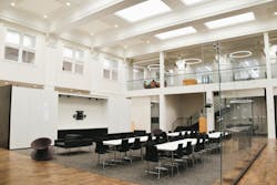 View of renovated auditorium space with original wood floors and plaster ceilings. View of renovated auditorium space with original wood floors and plaster ceilings.