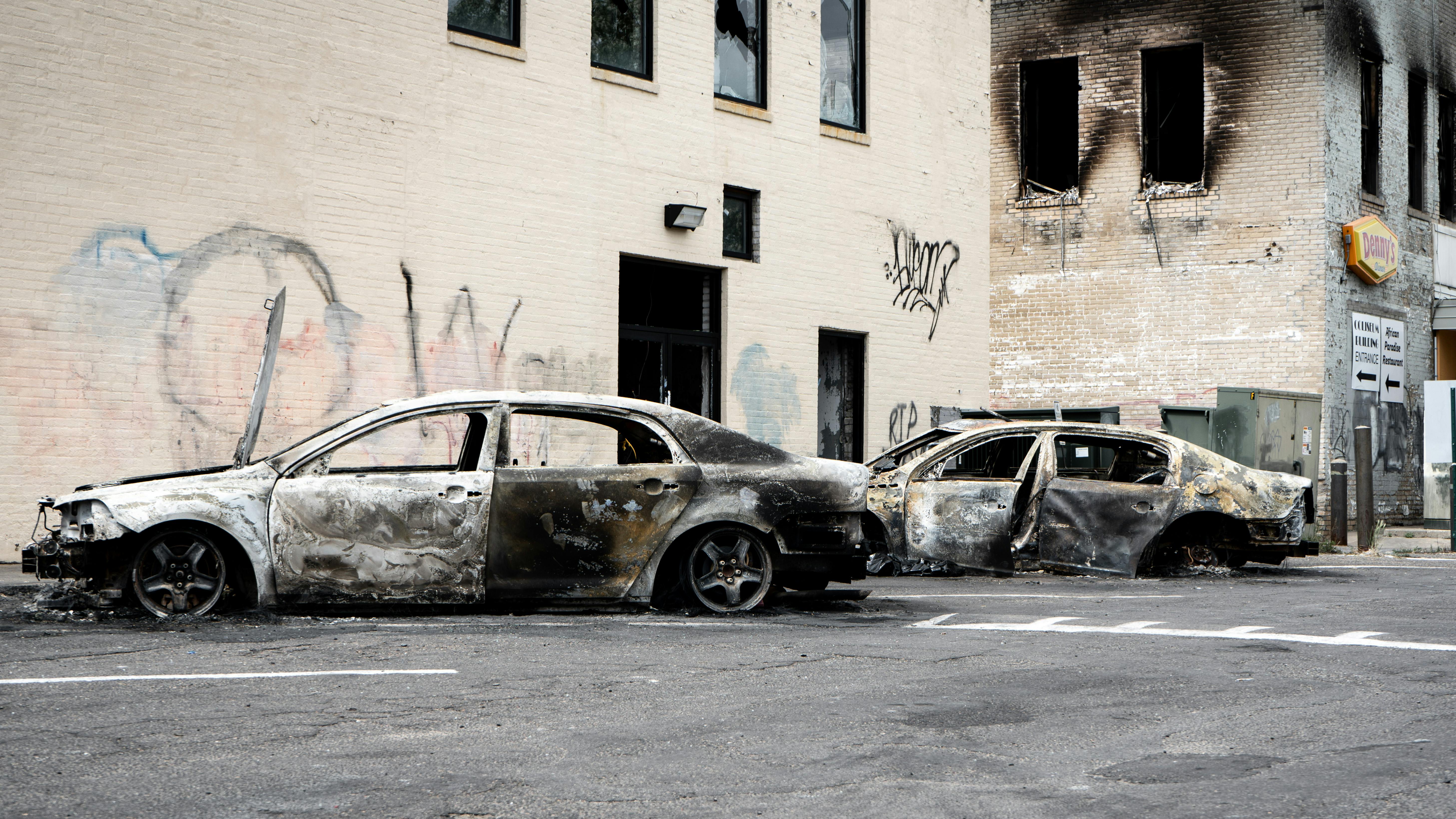 These cars in Minneapolis were damaged during a riot in summer 2020.