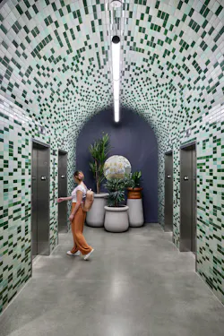 High-touch surfaces like the elevator lobby at Miscela, a mixed-use development in Sommerville, MA designed by Stantec, were finished with robust materials, selected to reduce maintenance and replacement needs.