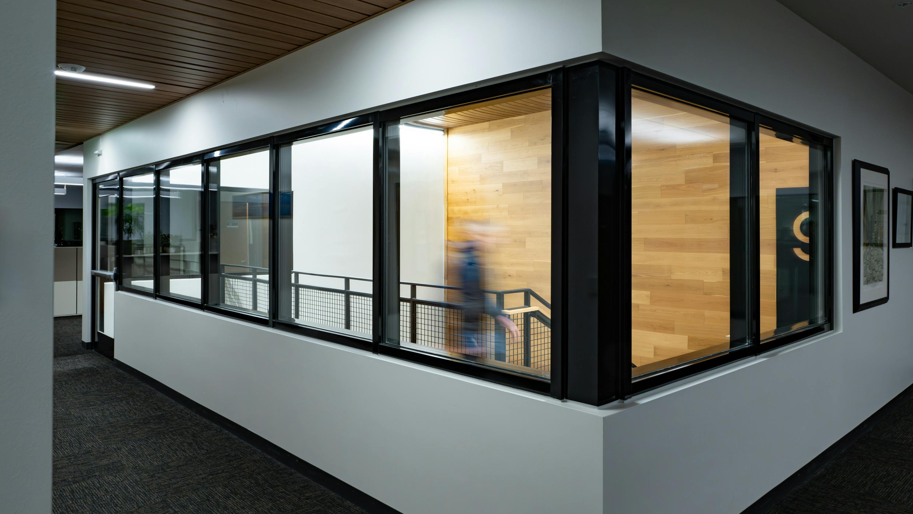 Fire-rated glazing provides transparent protection to safeguard means of egress routes.