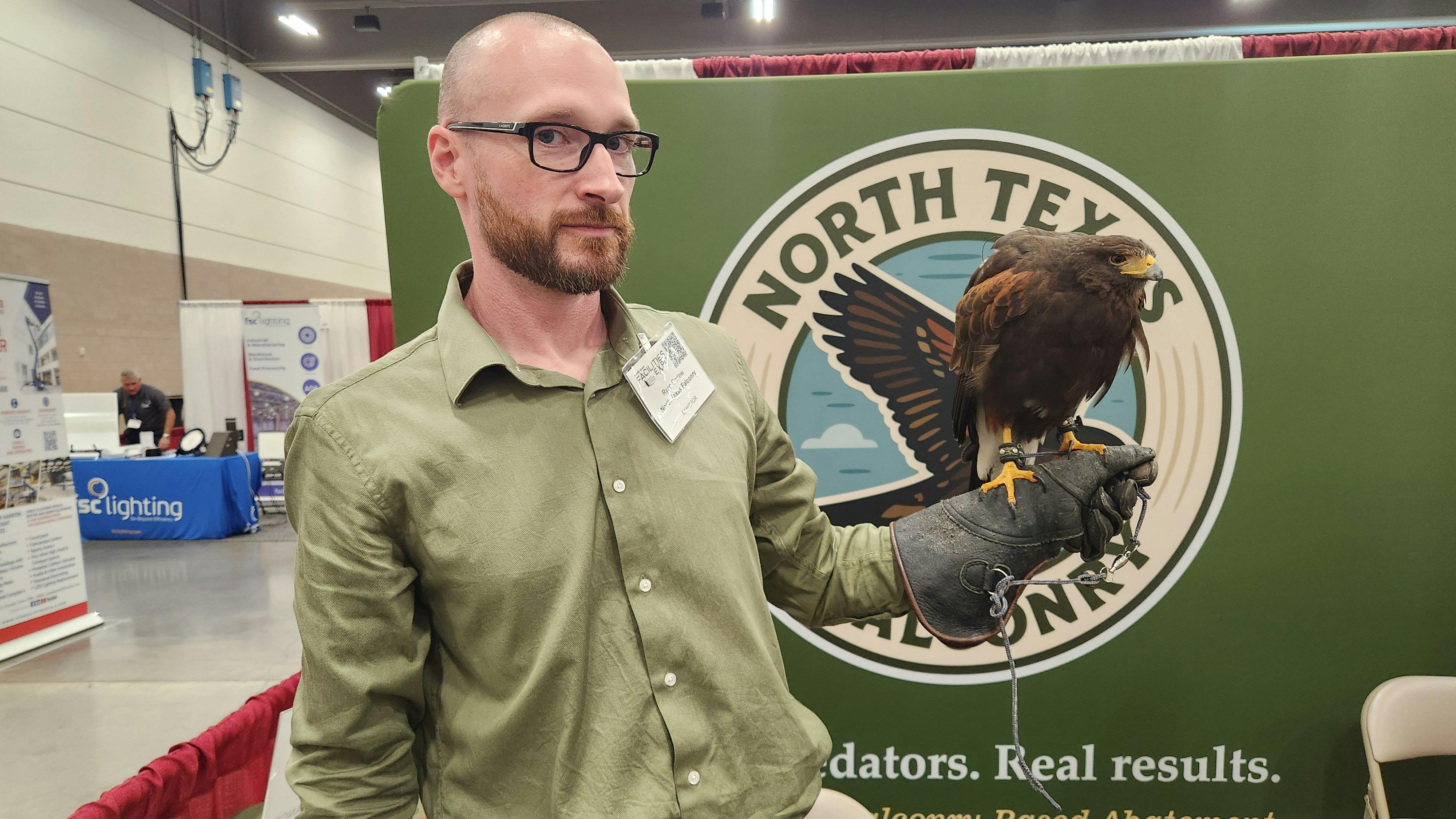 Ryan Corlew holds a falcon at the 2026 North Texas Facilities Expo.