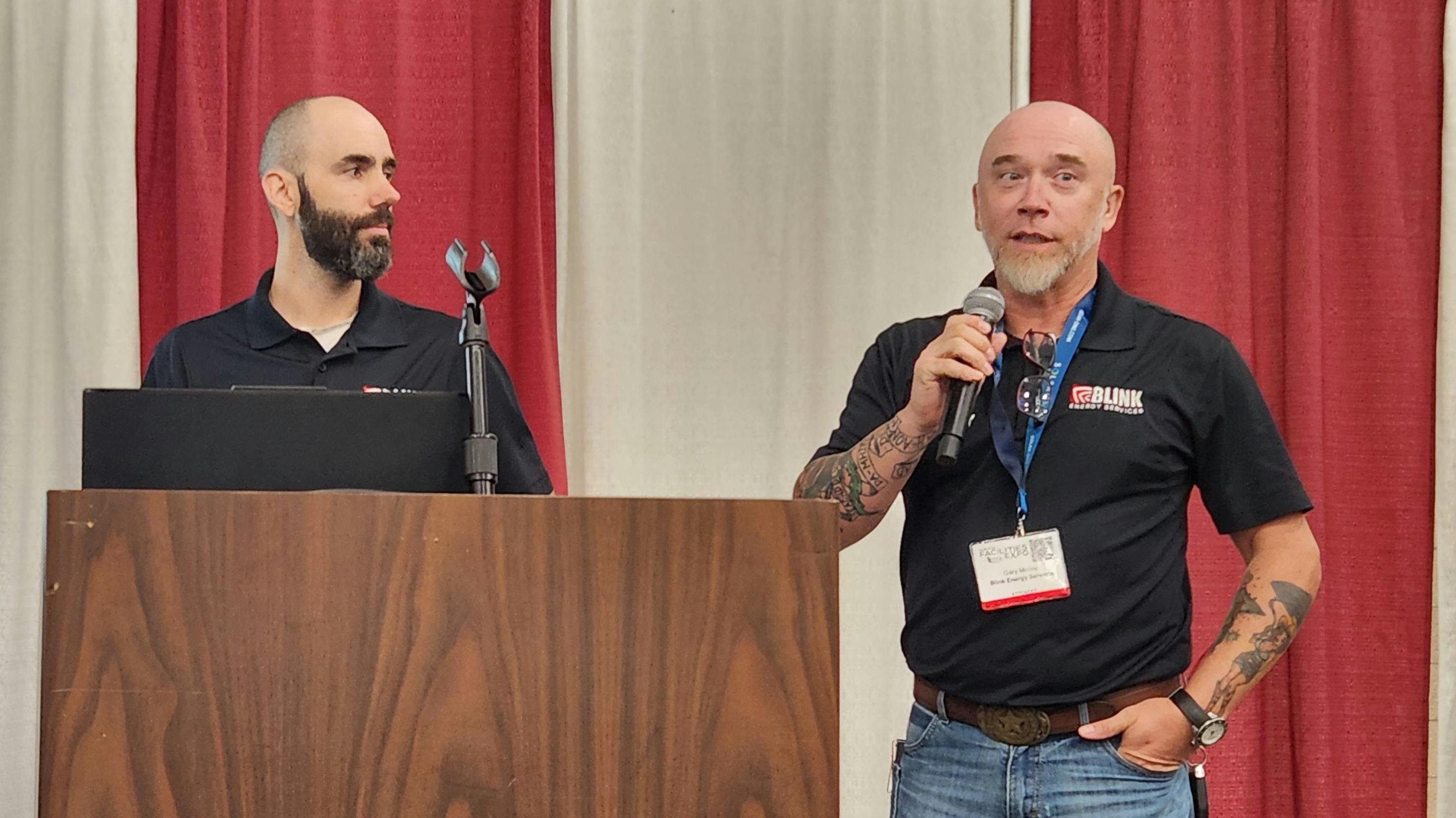 Maverick Allen and Gary McCoy, co-owners of Blink Energy Services, answer questions from the audience at the 2026 North Texas Facilities Expo.